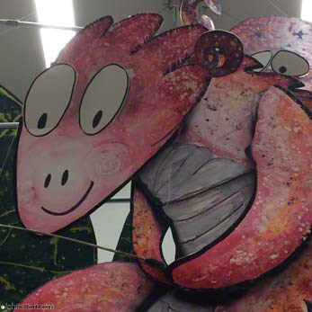 A happy and humerous Big Red fish hangs from the school ceiling