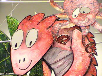 Big Red and Curly the octopus wait for a nibble in the library mobile